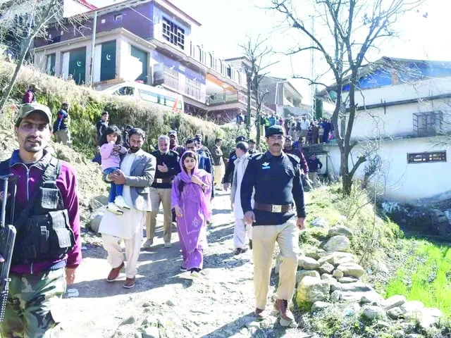 malala yousafzai is escorted by security personnel during her visit to her hometown barkana in khyber pakhtunkhwa s shangla district photo express malala yousafzai is escorted by security personnel during her visit to her hometown barkana in khyber pakhtunkhwa s shangla district photo express