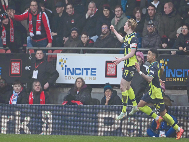 manchester city s kevin de bruyne 2r celebrates after scoring their second goal during the english fa cup fourth round match with leyton orient at gaughan group stadium on february 8 photo afp