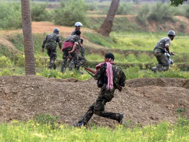 paramilitary soldiers run for cover during a gunfight with maoist rebels in pirrakuli village near lalgarh june 19 2009 photo reuters