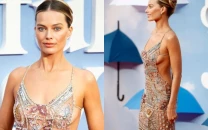 margot robbie stuns in sheer armani tribute gown in first red carpet since pregnancy