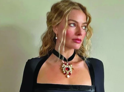 bradley and margot unite for high stakes ocean s origin bradley and margot unite for high stakes ocean s origin