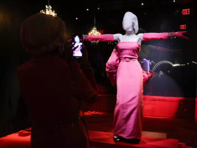 The iconic pink dress worn by Monroe during her performance of 'Diamonds Are a Girl's Best Friend', on display at the Academy Museum. © Valerie Macon, AFP