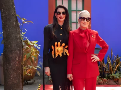 anne hathaway carries pakistani brand warp s bag on devil wears prada 2 press tour