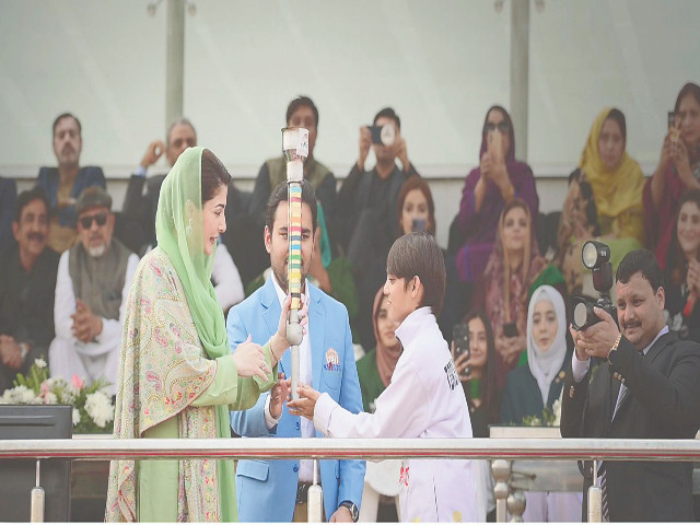 player shariqa habib hands over the torch to chief minister maryam nawaz at the opening ceremony of khelta punjab games photo express