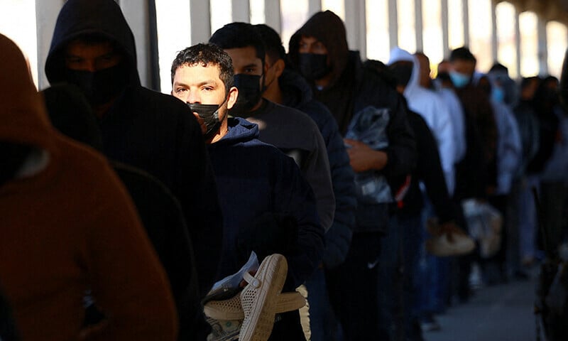 migrants line up to leave the united states for mexico after being deported across the paso del norte international border bridge after us president donald trump promised mass deportation operation as seen from ciudad juarez mexico january 23 photo reuters