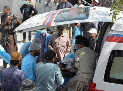 men and paramedic staff transfer a man who was injured in a blast in mastung from an ambulance outside hospital in quetta september 29 2023 photo reuters