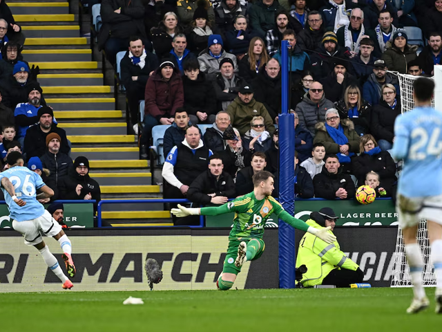 Manchester City's Savinho scores their first goal past Leicester City's Jakub Stolarczyk. Photo: Reuters