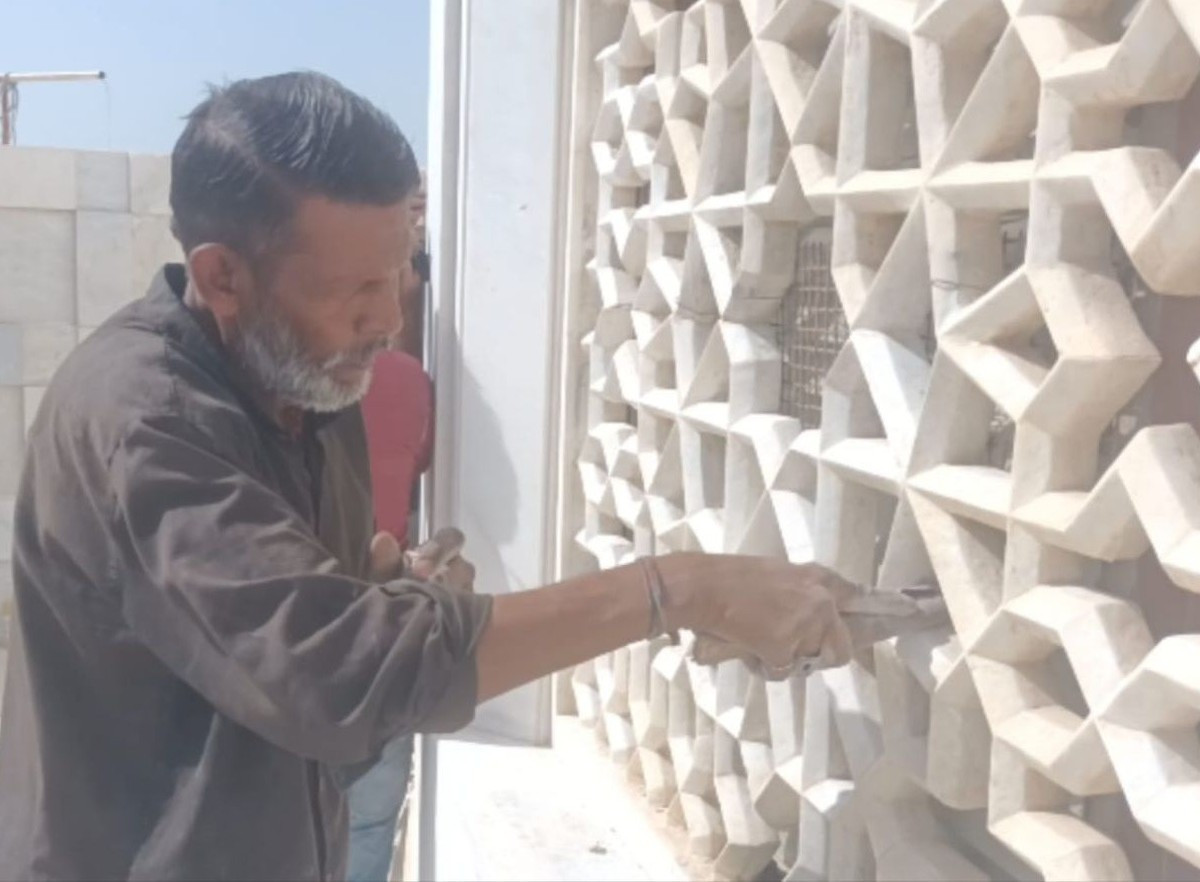A worker cleans and recoats marble. Source: The Express Tribune