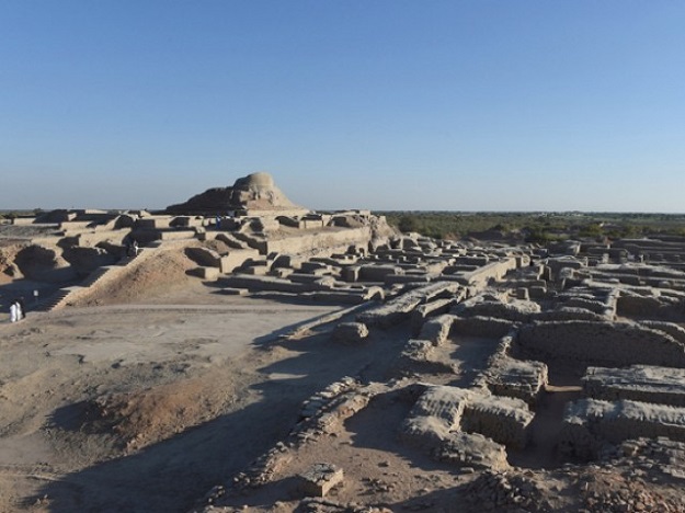 In this photograph taken on February 9, 2017, visitors walk through the UNESCO World Heritage archeological site of Mohenjo Daro some 425 kms north of the Pakistani city of Karachi. Once the centre of a powerful civilisation, Mohenjo Daro was one of the world's earliest cities -- a Bronze Age metropolis boasting flush toilets and a water and waste system to rival modern standards. Some 5,000 years on archaeologists believe the ruins could unlock the secrets of the Indus Valley people, who flourished around 3,000 BC in what is now India and Pakistan before mysteriously disappearing. PHOTO: AFP.