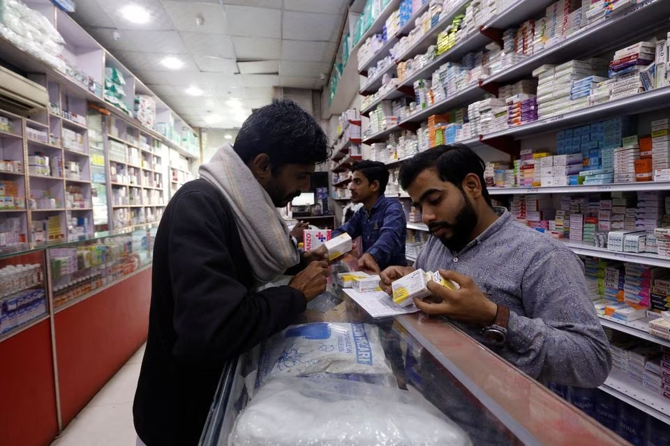 a customer buys medicine from a medical supply store in karachi pakistan february 9 2023 photo reuters file