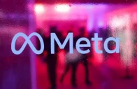 people walk behind a logo of meta platforms company during a conference in mumbai india september 20 2023 reuters