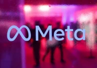 people walk behind a logo of meta platforms company during a conference in mumbai india september 20 2023 reuters