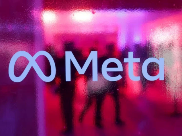 people walk behind a logo of meta platforms company during a conference in mumbai india september 20 2023 reuters people walk behind a logo of meta platforms company during a conference in mumbai india september 20 2023 reuters