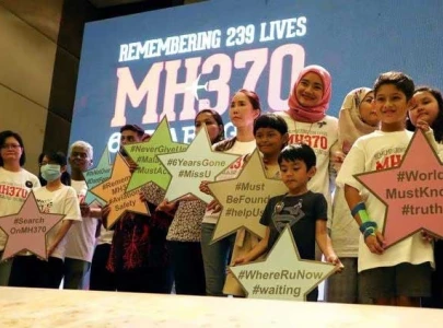 nine years on families urge new search for missing malaysia plane mh370