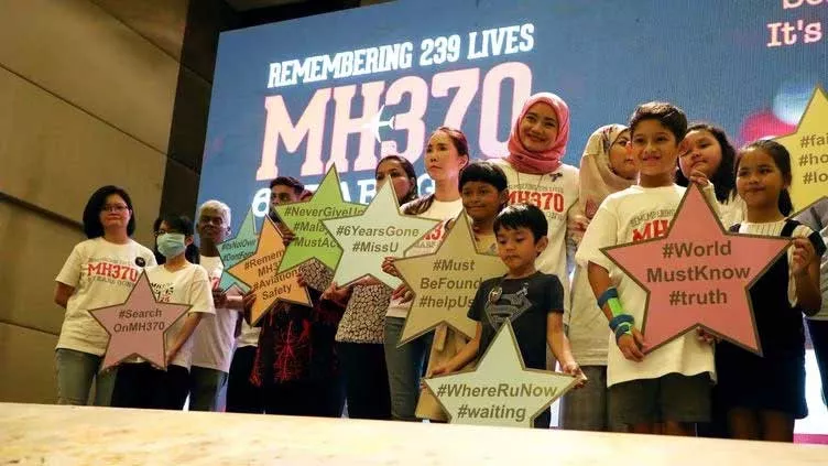 family members of the victims pose for a group picture with a debris of the missing malaysia airlines flight mh370 during its sixth annual remembrance event in putrajaya malaysia march 7 2020 photo reuters family members of the victims pose for a group picture with a debris of the missing malaysia airlines flight mh370 during its sixth annual remembrance event in putrajaya malaysia march 7 2020 photo reuters