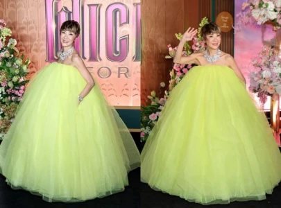 michelle yeoh trolled as neon loofah queen for wicked look