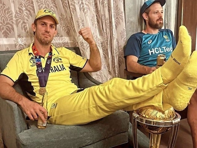 australian cricketer mitchell marsh booked in india for posing with his feet on the world cup trophy photo pat cummins s instagram page