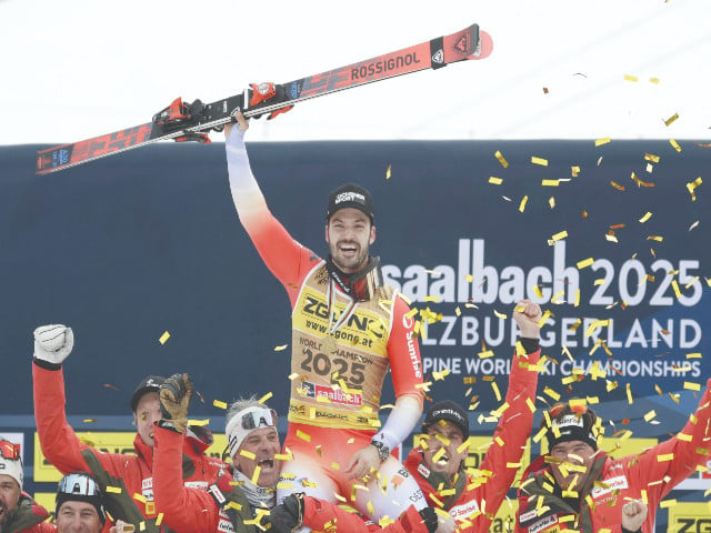 switzerland s loic meillard celebrates with his team after winning men s slalom at the fis alpine world ski championships at saalbach austria on february 16 photo reuters