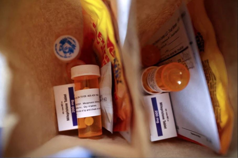 paper bags containing the medication used for a medical abortion follow up instructions and heating pads are prepared for patients who will be having abortions that day at trust women clinic in oklahoma city us december 6 2021 photo reuters file