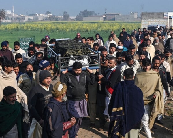 family members and residents carry the coffin of arslan khan a victim of last month s migrant boat capsizing off north africa during his funeral ceremony in mirza virkan village in eastern punjab province on february 6 2025 photo afp