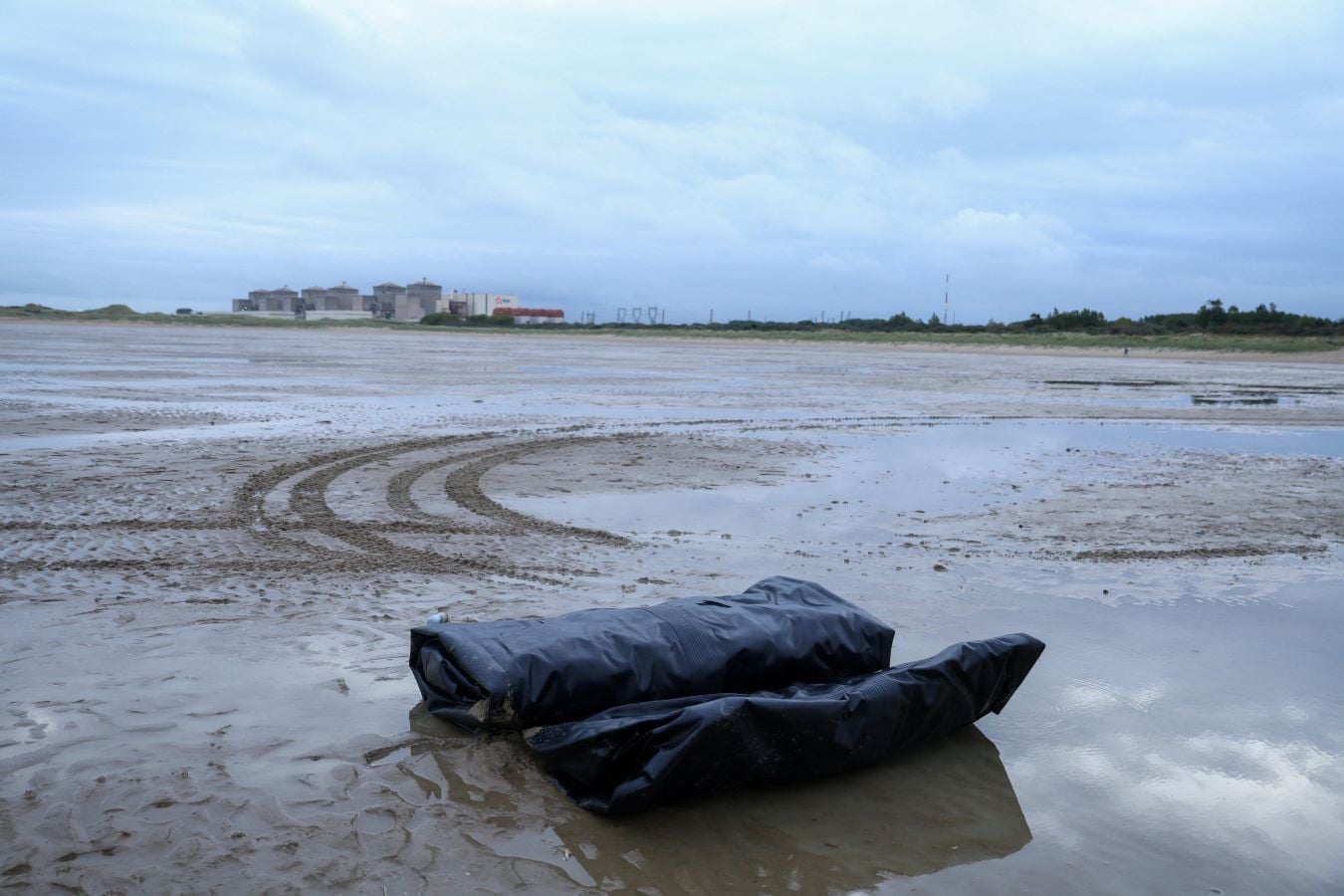 A dinghy left behind by migrants lies on the beach after police disperesed migrants attempting to leave the northern coast of France to cross the English Channel and reach Britain, at Petit-Fort-Philippe beach in Gravelines near Calais, France, September 28, 2026. REUTERS