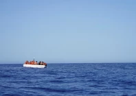 migrants on a fiberglass boat wait to be assisted by ngo open arms rescue boat astral in international waters south of lampedusa in the mediterranean sea july 24 2025 photo reuters