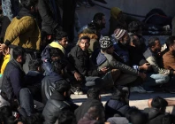 migrants wait to be transfered at the port of agia galini after been rescued by greek coast guard on the island of crete on december 19 2025 photo afp