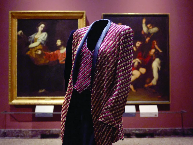 a mannequin wears archival giorgio armani designs displayed among italian art masterpieces at the pinacoteca di brera in the exhibition giorgio armani milano per amore which marks the 50th anniversary of the fashion house during milan fashion week in milan italy photo reuters