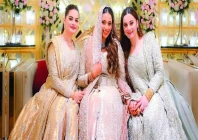 minal and aiman pose with their brother s wife sabah at her valima photo file