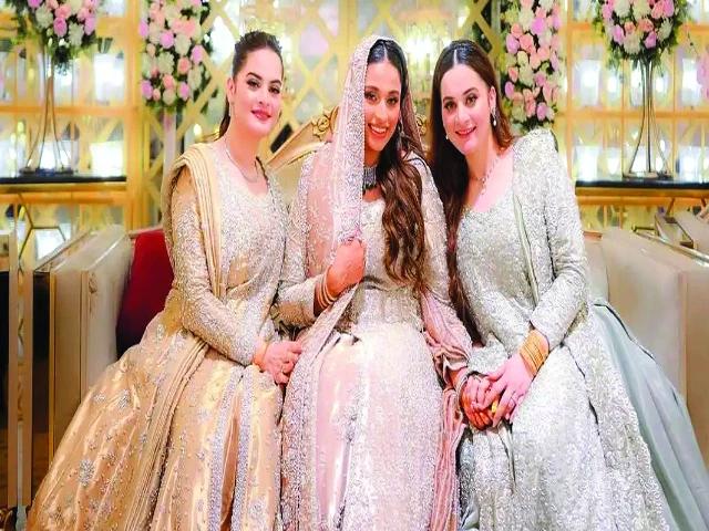minal and aiman pose with their brother s wife sabah at her valima photo file minal and aiman pose with their brother s wife sabah at her valima photo file