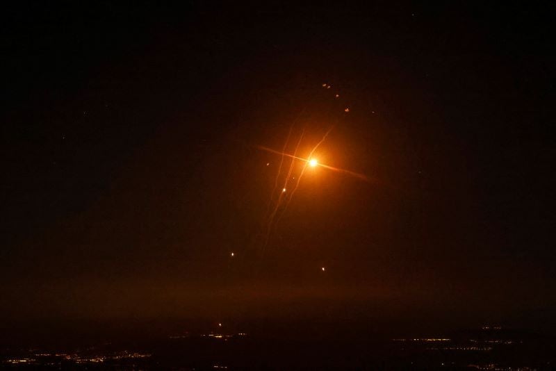 rockets fired from southern lebanon are intercepted by the iron dome air defense system over the upper galilee in northern israel on september 27 2024 photo afp