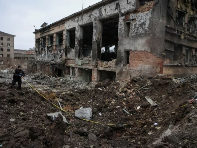 experts inspect a crater next to a building heavily damaged during a russian missile attack amid russia s attack on ukraine in central kharkiv ukraine january 2 2024 photo reuters experts inspect a crater next to a building heavily damaged during a russian missile attack amid russia s attack on ukraine in central kharkiv ukraine january 2 2024 photo reuters