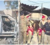 the destroyed car of miranshah assistant commissioner noor wali khan is seen in bannu security officials carry the coffin of the martyred ac photos express