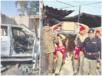 the destroyed car of miranshah assistant commissioner noor wali khan is seen in bannu security officials carry the coffin of the martyred ac photos express