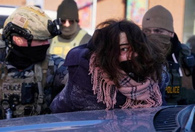 a person is detained at the scene of a shooting involving federal immigration agents in minneapolis minnesota us january 24 2026 photo reuters