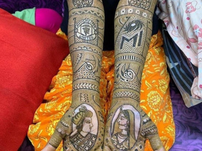 this sports fan featured her favourite clubs in her bridal mehendi