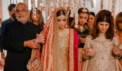 minna tariq opts for regal red and gold ensemble at star studded wedding ceremony minna tariq opts for regal red and gold ensemble at star studded wedding ceremony