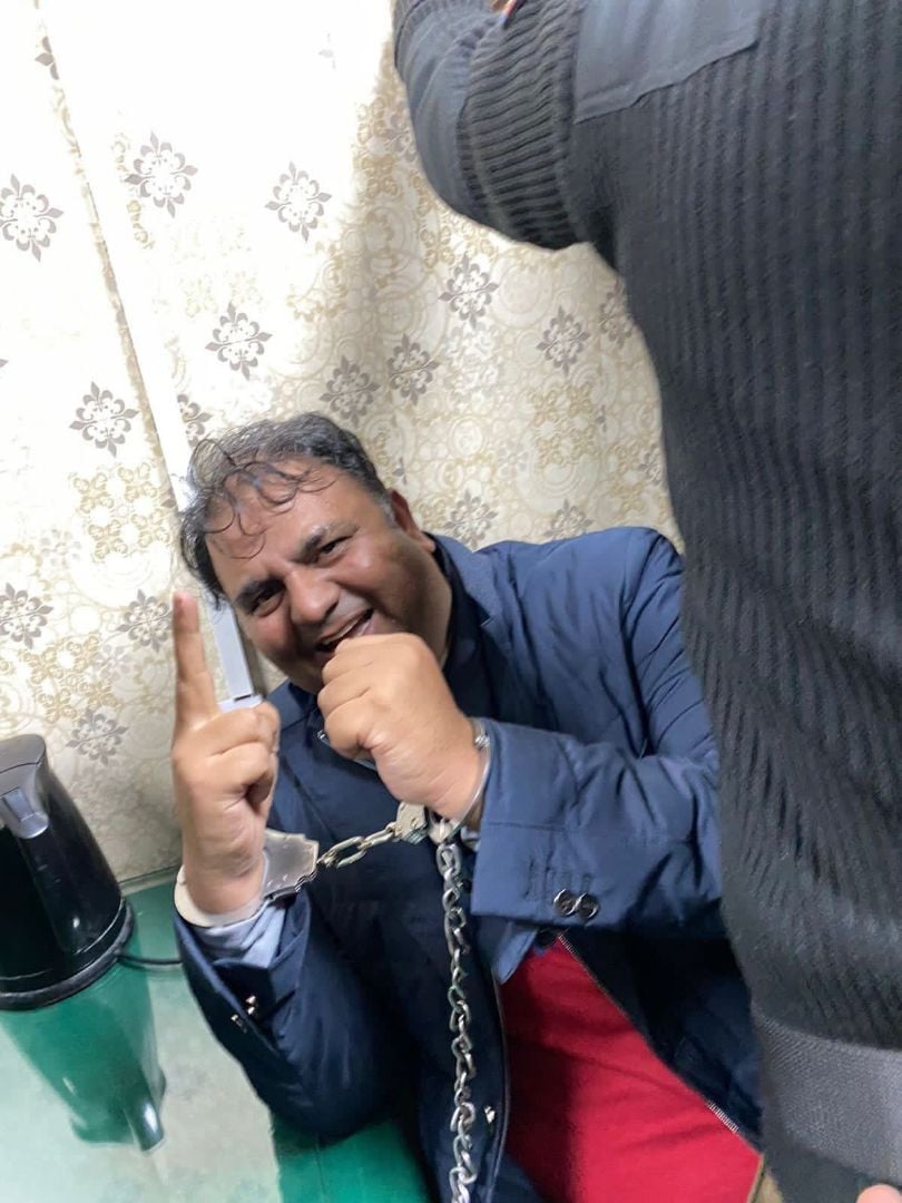 a picture of pti leader fawad chaudhary in custody of islamabad police on wednesday january 25 2023