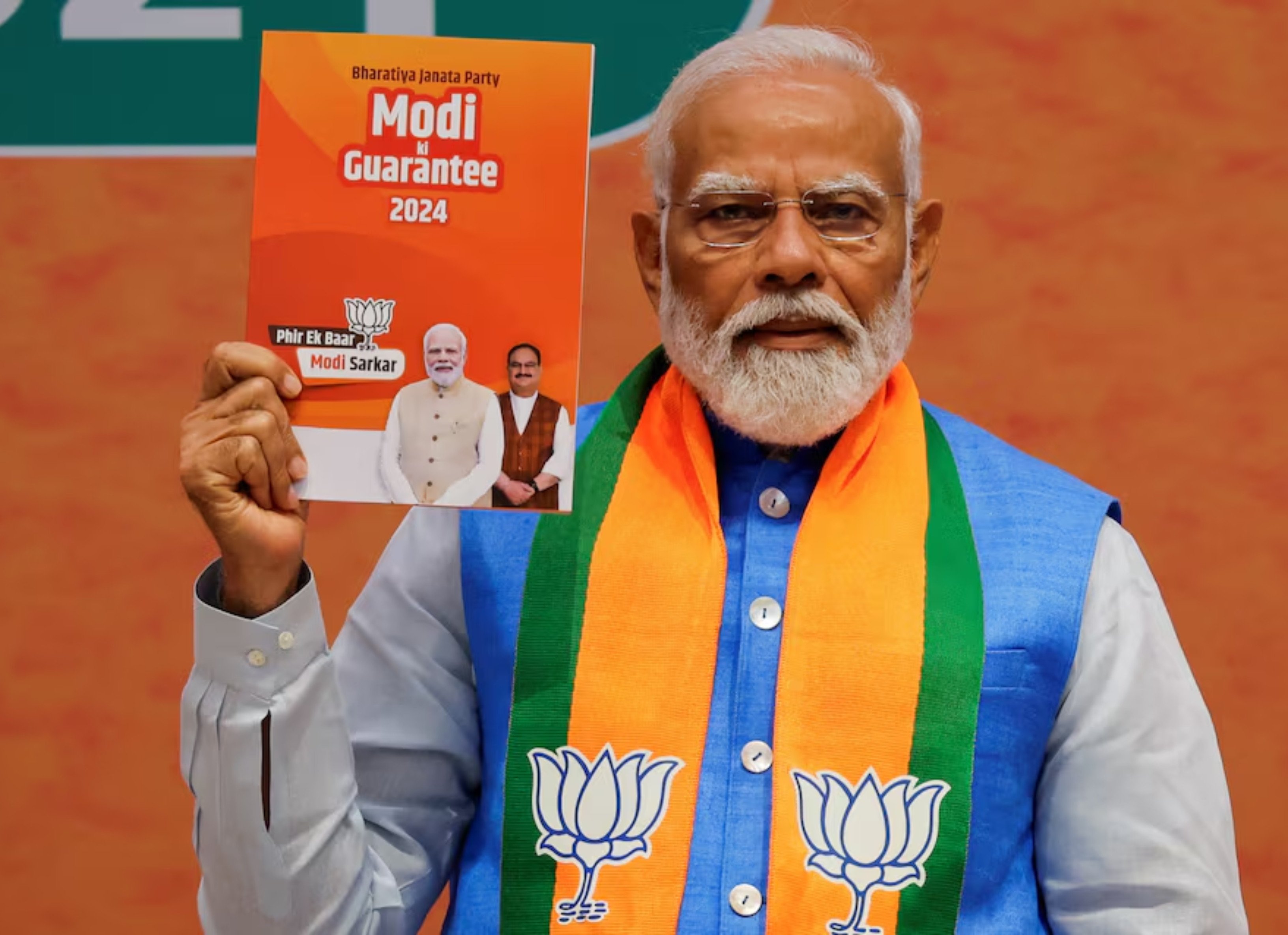 indian prime minister narendra modi displays a copy of the ruling bharatiya janata party s bjp election manifesto for the general election in new delhi india april 14 2024 photo reuters