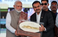 indian businessman gautam adani presents a plaque to india s prime minister narendra modi during the inauguration of the navi mumbai international airport in ulwe raigad district india october 8 2025 photo reuters