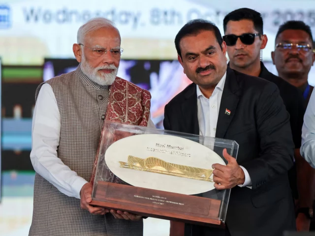 indian businessman gautam adani presents a plaque to india s prime minister narendra modi during the inauguration of the navi mumbai international airport in ulwe raigad district india october 8 2025 photo reuters indian businessman gautam adani presents a plaque to india s prime minister narendra modi during the inauguration of the navi mumbai international airport in ulwe raigad district india october 8 2025 photo reuters