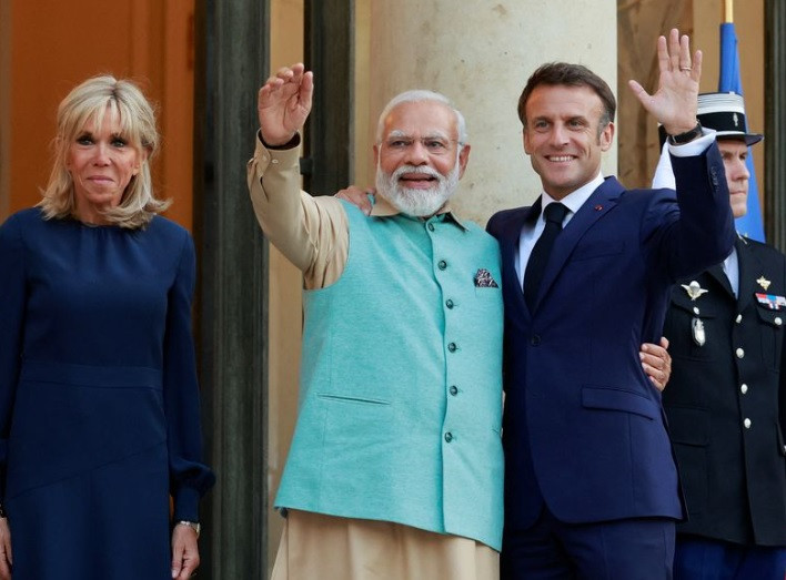 french president emmanuel macron and his wife brigitte macron welcome indian prime minister narendra modi at the elysee palace in paris france july 13 2023 reuters pascal rossignol