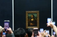 visitors take pictures of the painting mona lisa la joconde by leonardo da vinci at the louvre museum on the day it reopened to the public for the first time since last sunday s heist while the galerie d apollon where eight pieces of napoleon and the empress s jewelry collection displayed in the gallery were stolen by thieves remains closed in paris france october 22 2025 photo reuters