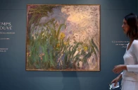 a visitor walks past the painting iris 1924 1925 by french painter claude monet 1840 1926 during the presentation of 28 art works from the schlumberger collection ahead of the auction at sotheby s auction house in paris france september 17 2026 photo reuters
