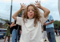 moroccan girl amira makes a funny face at el trampolin beach in ceuta