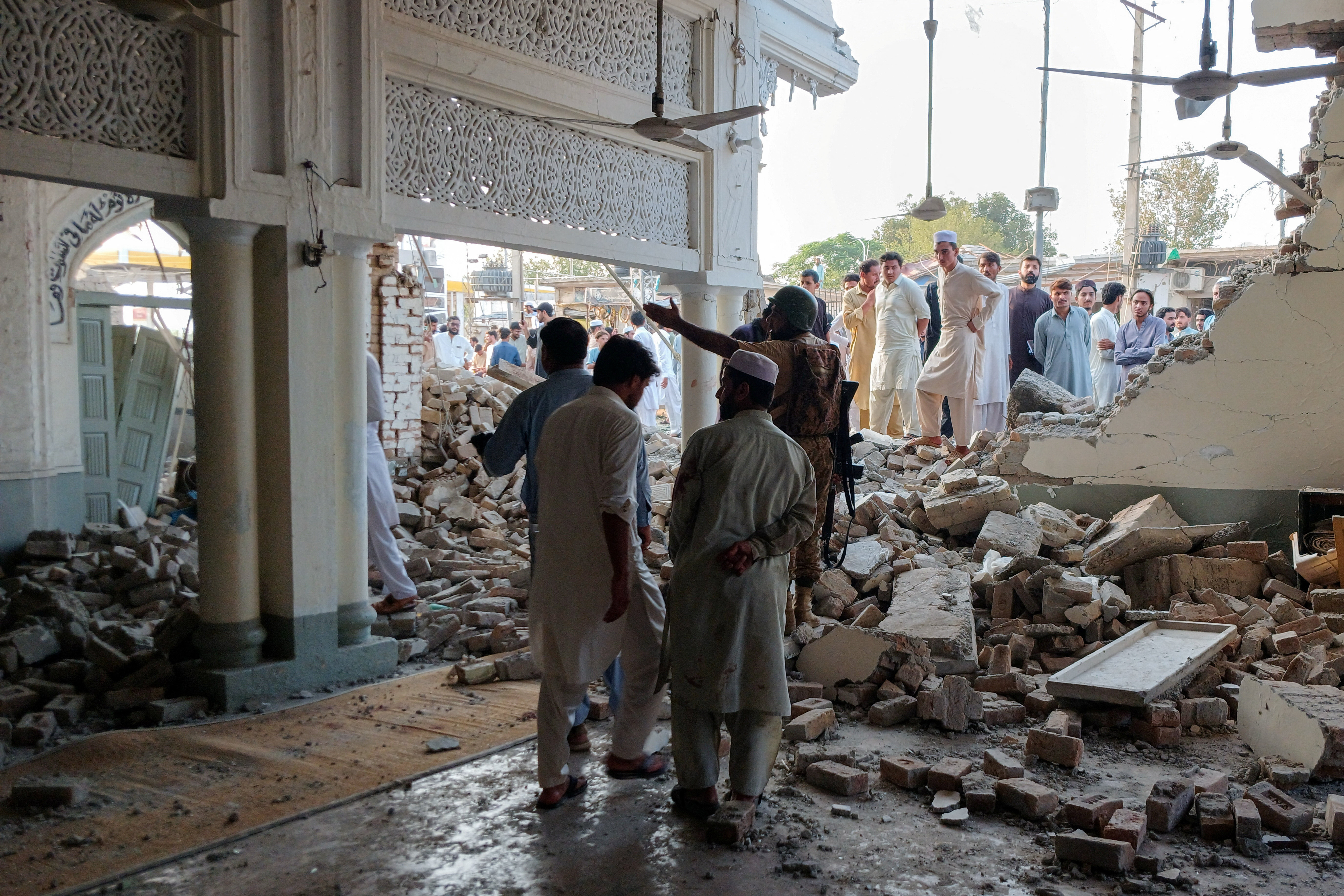 People gather at a damaged mosque following a suicide attack at a police facility in Kohat, Pakistan, September 18, 2026. Photo: Reuters