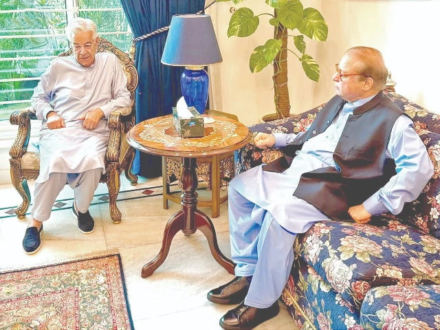 pml n chief nawaz sharif meets khawaja asif at his residence on friday as political smoke thickens over the minister s future in the cabinet photo nni pml n chief nawaz sharif meets khawaja asif at his residence on friday as political smoke thickens over the minister s future in the cabinet photo nni