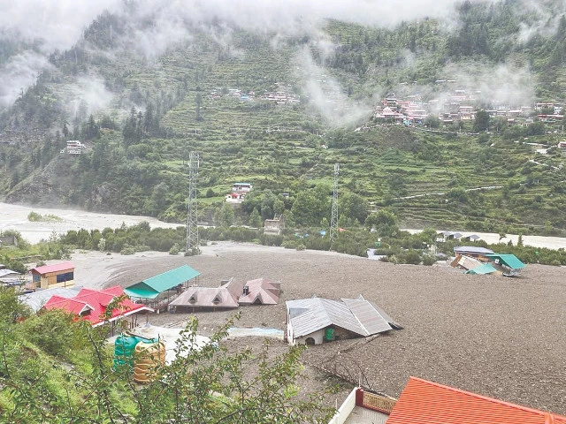 residential buildings are seen partially submerged in sludge in uttarakhand state photo afp residential buildings are seen partially submerged in sludge in uttarakhand state photo afp