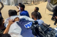 mourners carry the body of palestinian al jazeera photojournalist mohamed salama who was killed in an israeli strike on nasser hospital during his funeral in khan yunis in the southern gaza strip on august 25 2025 photo afp