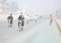 commuters pass through dense smog in multan photo app